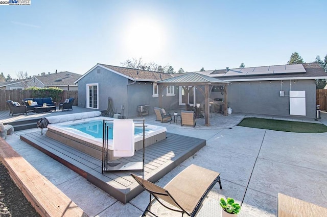 view of swimming pool with a gazebo and an outdoor hangout area