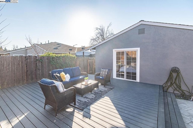 wooden deck with an outdoor hangout area