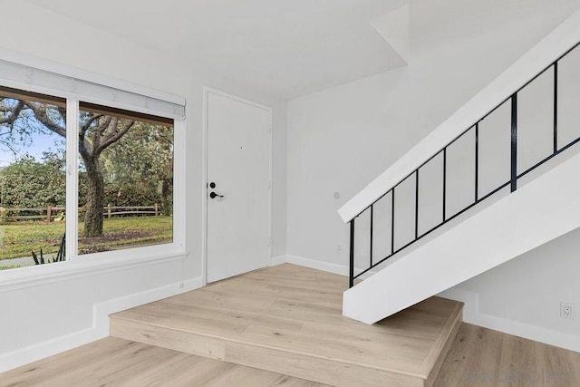 entryway featuring plenty of natural light and light hardwood / wood-style floors