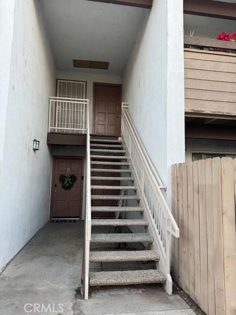 staircase with concrete floors