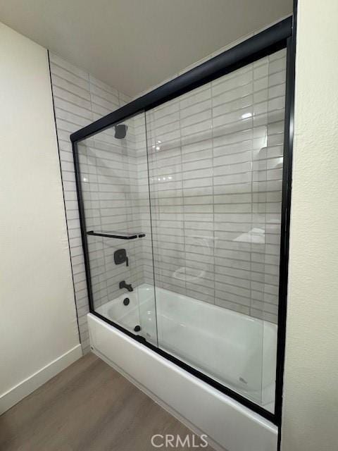 2501 W Sunflower Unit F12, Santa Ana, CA 92704 - bathroom featuring wood finished floors and enclosed tub / shower combo