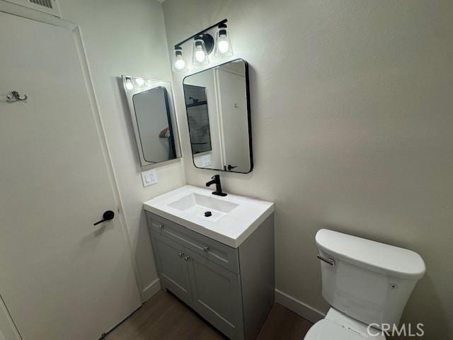 2501 W Sunflower Unit F12, Santa Ana, CA 92704 - bathroom featuring vanity and wood finished floors
