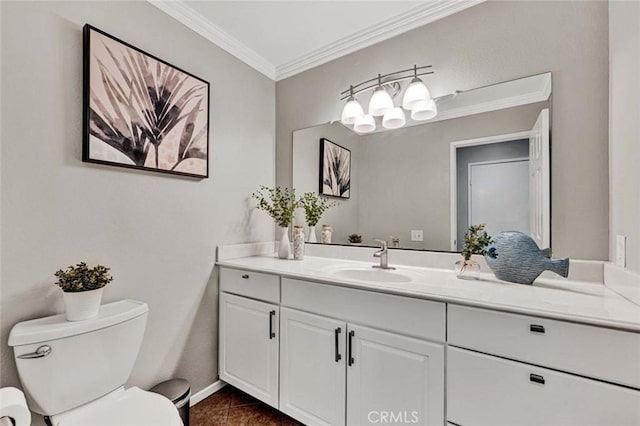 bathroom with crown molding, vanity, toilet, and tile patterned flooring