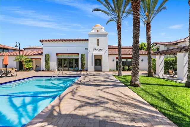 exterior space featuring a patio and a lawn