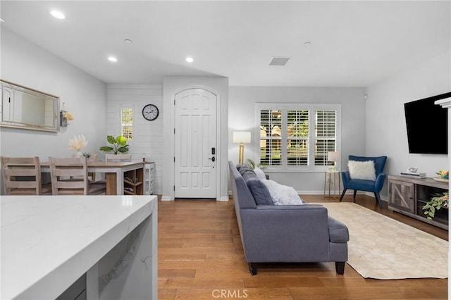 living room with light hardwood / wood-style flooring