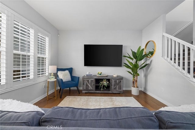 living room featuring dark wood-type flooring