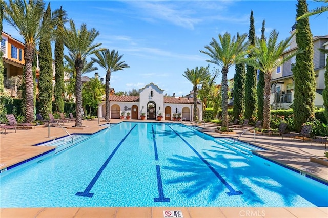 view of swimming pool with a patio