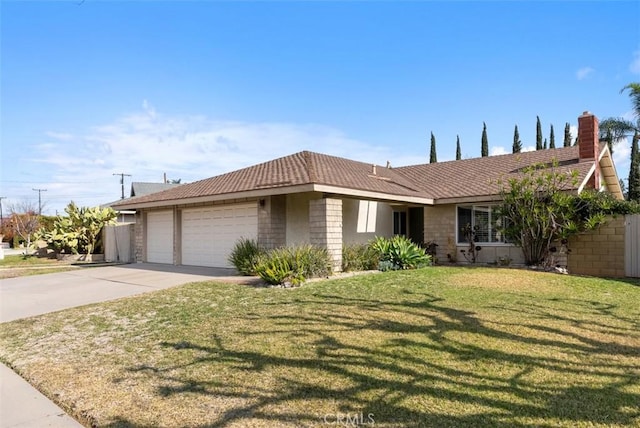 ranch-style house with a garage and a front lawn