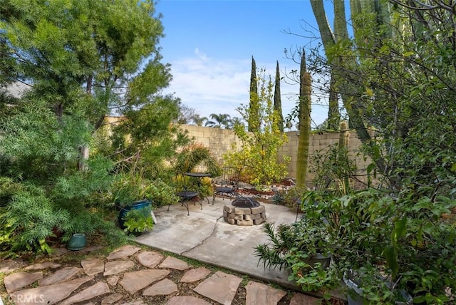 view of patio / terrace with an outdoor fire pit