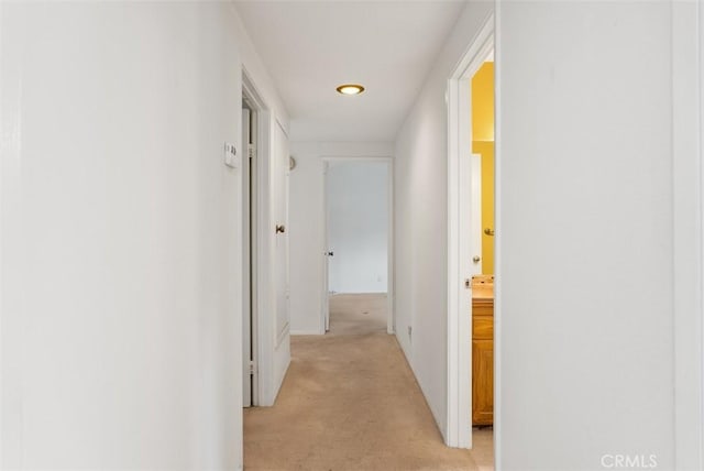 corridor with light colored carpet