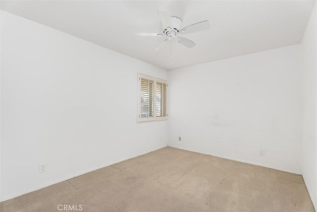 unfurnished room with ceiling fan and light colored carpet