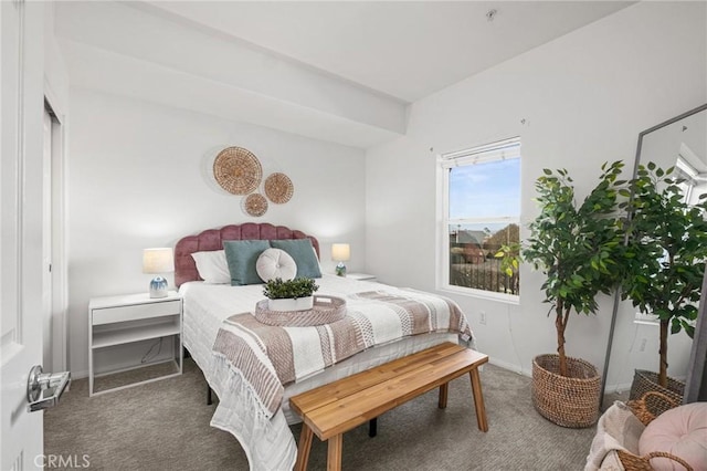 bedroom featuring dark carpet