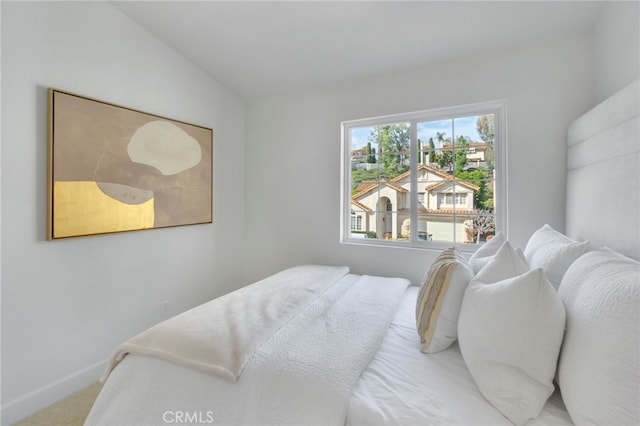 bedroom featuring lofted ceiling