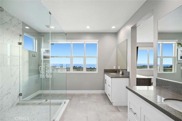 bathroom with vanity and walk in shower