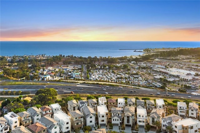 aerial view at dusk with a water view