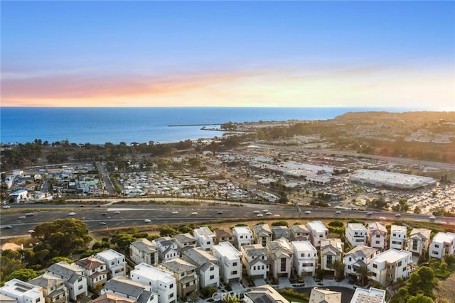 aerial view at dusk with a water view