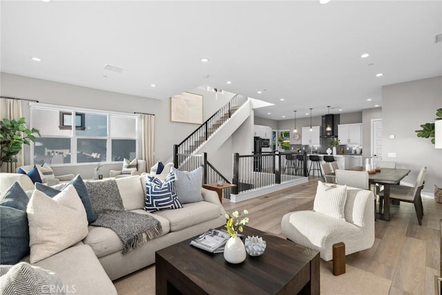 living room with plenty of natural light and light wood-type flooring