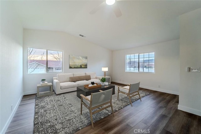 living room with ceiling fan, lofted ceiling, and dark hardwood / wood-style flooring