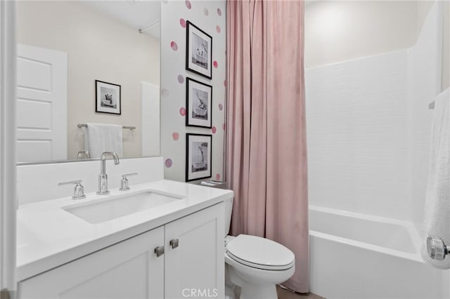 full bathroom featuring vanity, toilet, and shower / bath combo