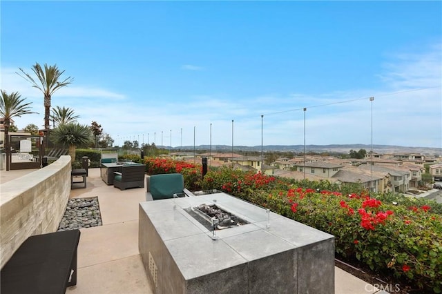 view of patio with an outdoor fire pit