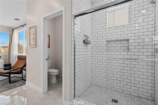 bathroom featuring walk in shower and toilet