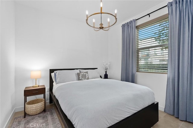 bedroom with an inviting chandelier