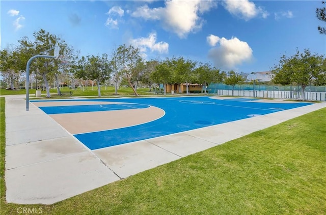 view of basketball court featuring a lawn