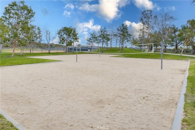 surrounding community featuring a yard and volleyball court