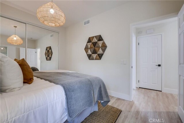 bedroom with light wood-type flooring