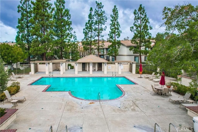 view of swimming pool with a gazebo and a patio