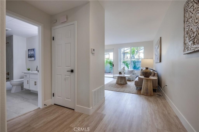 corridor featuring light hardwood / wood-style flooring