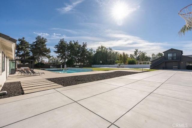 view of swimming pool featuring a patio