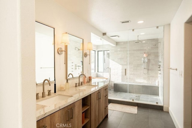 bathroom with vanity, tile patterned flooring, and walk in shower