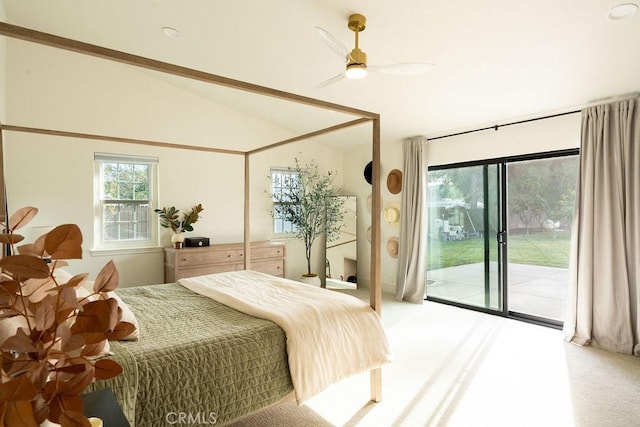 bedroom featuring ceiling fan, vaulted ceiling, light carpet, and access to outside