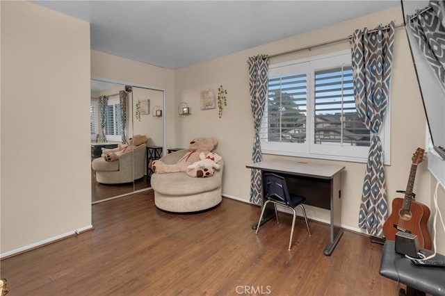 sitting room with hardwood / wood-style floors