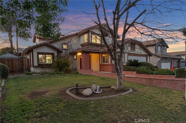 view of front of home with a lawn