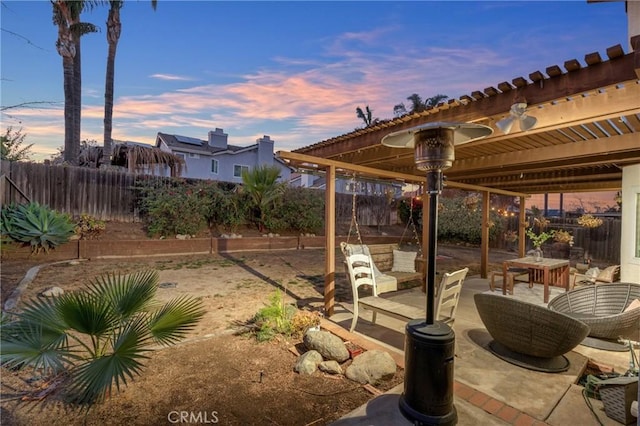 view of patio terrace at dusk