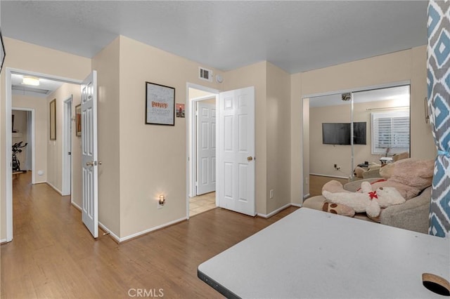 bedroom with hardwood / wood-style flooring