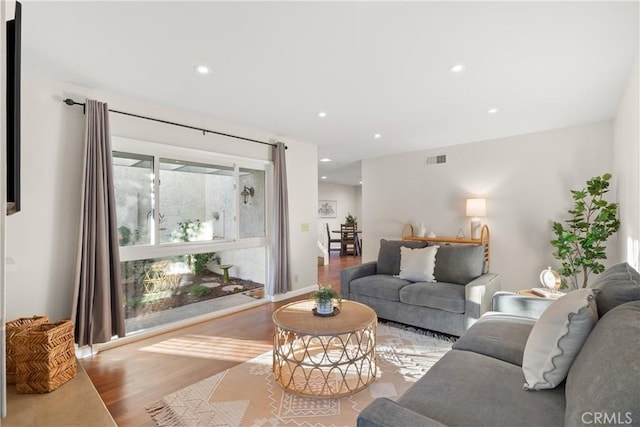 living room with light hardwood / wood-style floors