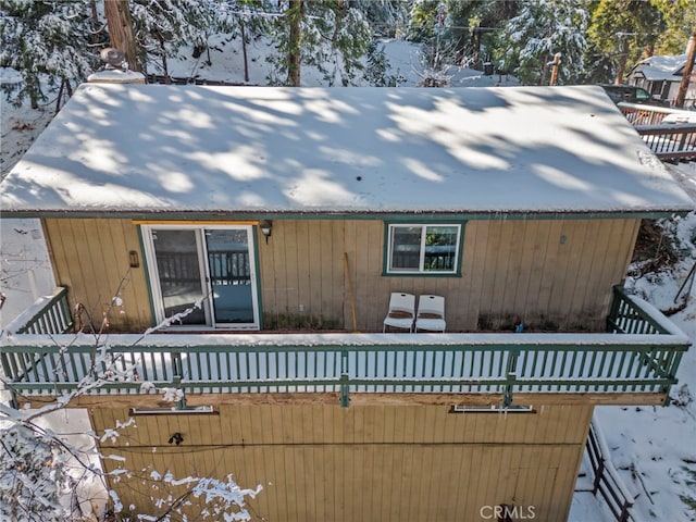 view of snow covered house