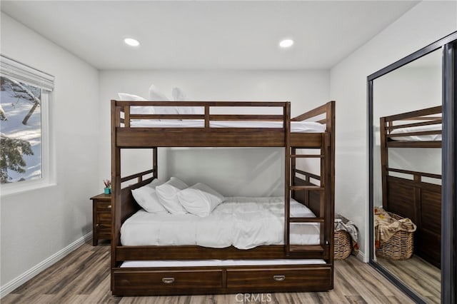 bedroom with hardwood / wood-style flooring