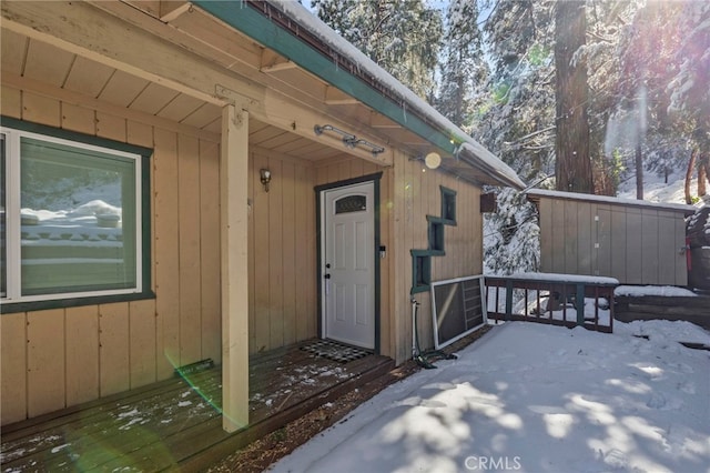 view of snow covered property entrance