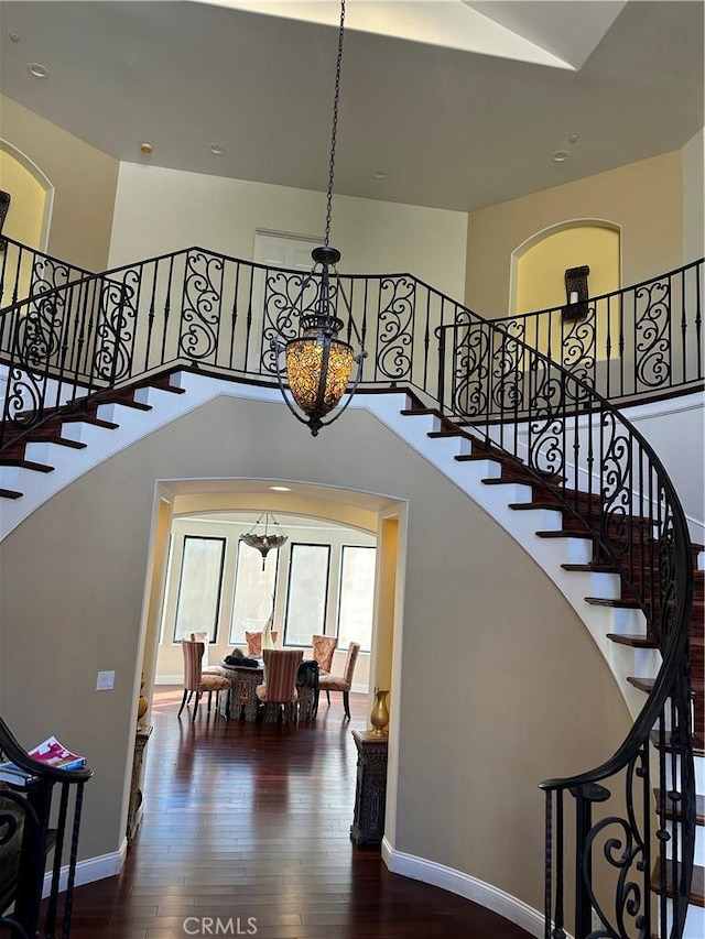 stairway featuring hardwood / wood-style floors