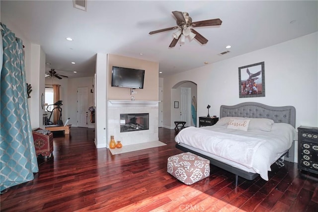 bedroom with dark wood-type flooring and ceiling fan