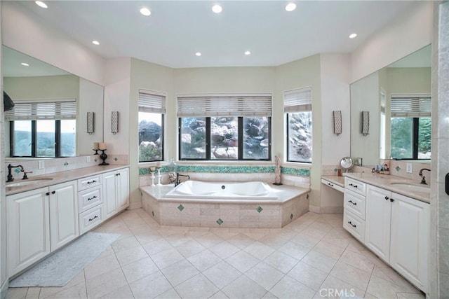 bathroom with vanity, plenty of natural light, and tile patterned floors