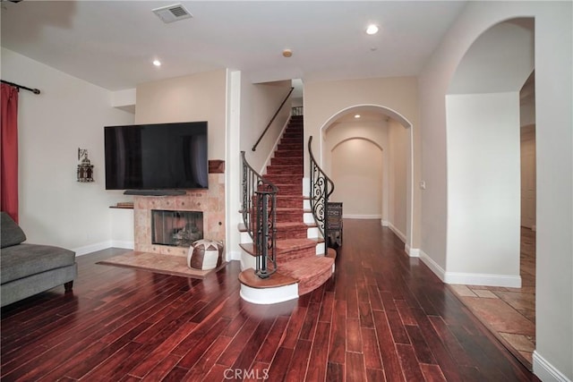 entryway with a fireplace and hardwood / wood-style floors