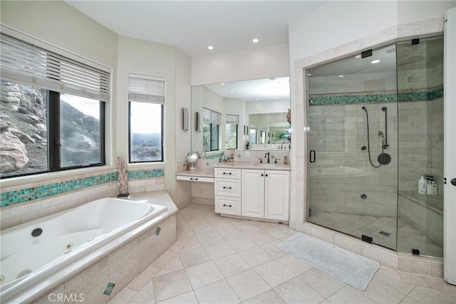 bathroom with independent shower and bath, vanity, and tile patterned floors