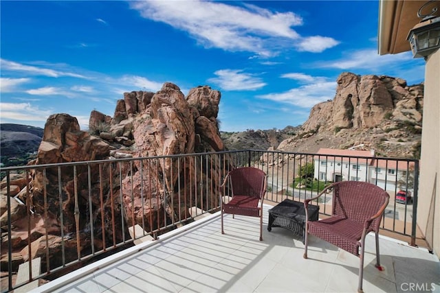 balcony featuring a mountain view