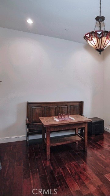 living area with dark hardwood / wood-style flooring