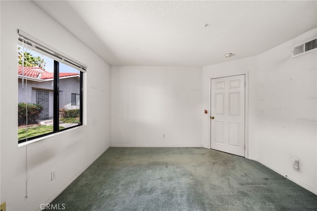 unfurnished room with carpet floors